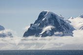 Low bands of cloud along the glaciated, mountainous coast of the Antarctic Peninsula
