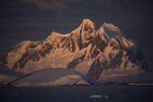 Dusk along the Antarctic Peninsula, Argentine Islands and mountains.