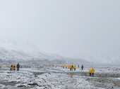 Tourists visit Fortuna Bay in snowy conditions. South Georgia. Sub Antarctic Islands.