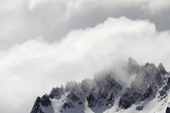 Mountain top draped in cloud. Drygalski Fjord. South Georgia. Sub Antarctica