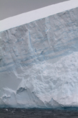 Layers show clearly in a Tabular Iceberg that has tilted. Antarctica