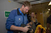 Expedition Staff James checks passengers clothing for seeds and Guano prior to an Antarctic Landing