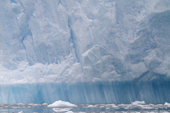 Layers of ice in an iceberg indicate that it rolled at 90 degrees to how they were laid down. Antarctica