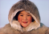 Portrait of an Inuit girl wearing a caribou skin parka. Baffin Island, Nunavut, Canada. 1987