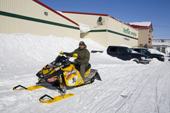 Ronnie Akerolik, driving his new Skidoo (snowmobile) in the Inuit community of Rankin Inlet. Nunavut, Canada. 2008