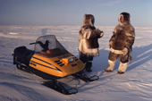 Two Inuit men talking during a break on a winter caribou hunt.Igloolik, Nunavut, Canada. 1990