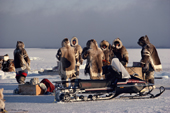 Inuit hunters stop for a break while seal hunting at the floe edge near Igloolik, Nunavut, Canada. 1990