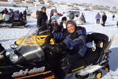 Young Inuit on a snowmobile during Easter festivities at Arctic Bay. Baffin Island, Nunavut, Canada. 2005
