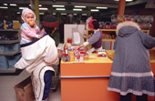 Inuit women check out their shopping at the store in Baker Lake. Nunavut. Canadian Arctic. 1982