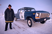 Inuit member of the RCMP. Royal Canadian Mounted Police with his police van. Baker Lake. Nunavut. Canada. 1982