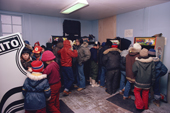 Inuit children play video games in an amusement room. Baker Lake, Nunavut. Canada. 1982