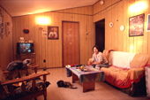 Inuit woman watches television in her home in Baker Lake. Nunavut. Canadian Arctic. 1982