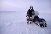 Inuit hunter, Tom Kudloo on a hunting trip on his snowmobile. Baker Lake. Nunavut. Canadian Arctic. 1982