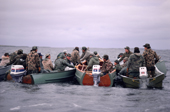 Cree hunters meet up in canoes to discuss tactics on an autumn goose hunt in James Bay, N.Quebec, Canada. 1988