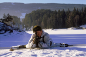 Royal Marines Arctic Training. Marine firing a rifle. Fagernes, Norway.