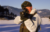 Royal Marines Arctic Training. Marine firing a rifle. Fagernes, Norway.