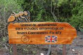 Hand carved wooden sign for the insect unit at the Charles Darwin Research Station. Puerto Ayora. Santa Cruz. Galapagos
