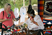 The Primicias Farm, a woman at a stall sells souvenirs to the visitors. Santa Cruz. Galapagos.