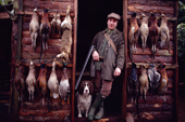 Dashwood on a Hampshire pheasant shoot with spaniel, Hannah, & the days bag. England.
