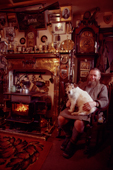Highland Stalker Bob Bisset with his terrier on his knee Glen Lyon. Scotland.