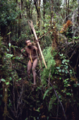 Niot, a Yali man hunting with a bow & arrow in the rainforest. Seng Valley, Irian Jaya. Indonesia. 1990