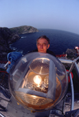 Lighthouse keeper cleaning the light. Baccalieu Island, Newfoundland, Canada. 1983
