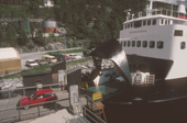 Car leaving ferry across bottom of Sognfjorden. Kaupanger. Central Norway. 1995