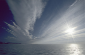 Midnight Sun shines through Altostratus clouds over summer sea ice. Novaya Zemlya. Russia. Barents Sea. 1998
