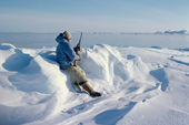 Inuit hunter, Ituko, hunting seals with a rifle at the floe edge in Melville Bay. N.W.Greenland. 1980