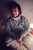 Smiling Inuit youth, Jorgen Hensen, in polar bear pants. Northwest Greenland. 1980