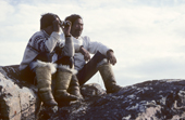 An Inuit hunter and his son watch Narwhals through binoculars at a summer hunting camp. Thule, Northwest Greenland. 1980