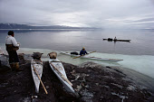 Inuit hunters using kayaks to hunt Narwhal during the summer in Inglefield Bredning. Northwest Greenland. (1980)