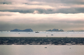 Icebergs & sea ice just after break up in Inglefield Bay, Northwest Greenland. 1980