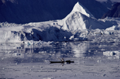 Inuit hunter, Qulutanguak, in his kayak in the ice strewn waters of Inglefield Bredning, N.W. Greenland. 1980