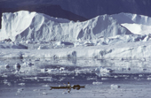 Inuit hunter in his kayak in the ice strewn waters of Inglefield Bredning, N.W. Greenland. 1980