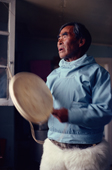 Masautsiaq Eipe, an elderly Inuit man, drum sings using a traditional drum. Only the rim of the drum is struck. Qaanaaq, Avanersuaq, Northwest Greenland. (1980)