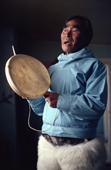 Masautsiaq Eipe, an elderly Inuit man, drum sings using a traditional drum. Only the rim of the drum is struck. Qaanaaq, Avanersuaq, Northwest Greenland. (1980)