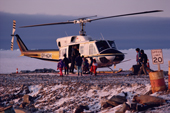 A helicopter bringing supplies arrives at the Inuit village of Savissivik. NW Greenland. 1991