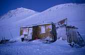 An Inuit hunter's wooden home during the winter dark time at Savissivik. Avanersuaq, Northwest Greenland. (1998)