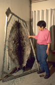 Mikivssuk Karlsen, an Inuit woman, stretches a sealskin on a frame to dry it. Savissivik. NW Greenland. 1998