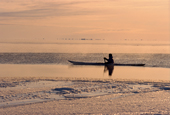 At -32 Celsius, an Inuit hunter paddles his kayak in Melville Bay. N.W. Greenland. 1998