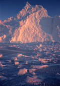 Sunlight reflecting off an iceberg frozen in during winter. Inglefield Bay, Northwest Greenland. 1998