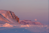 The moon rising in Inglefield Bay during the winter. N.W. Greenland. 1998