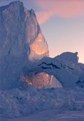 Light from the setting sun reflects off the surface of a big iceberg. Inglefield Bay, N.W.Greenland. 1998