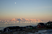 View from Qaanaaq of Herbert Island and Inglefield Bay with icebergs at dawn in the autumn. Qaanaaq, Northwest Greenland.(2021)