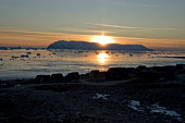 A view of Herbert Island from Qaanaaq at sunset in the autumn. Avanersuaq, Northwest Greenland. (2021)