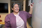 Tukumeq Qaerngaq, an Inuit woman, at the school in the community of Qaanaaq where she is Vice Principal. Avanersuaq, Northwest Greenland. (2021)