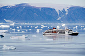 The German cruise ship 'Hanseatic Inspiration' in Inglefield Bay while visiting the Inuit community of Qaanaaq. Northwest Greenland. (2022)