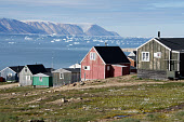 Wooden houses in the Inuit community of Qaanaaq. Northwest Greenland. (2022)