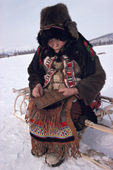 Elderly Even woman holding a traditional wooden calendar. Chukotka. Siberia. Russia. 1994